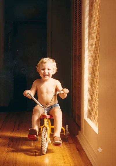 Paul Hamon aged 3 on his yellow tricycle, Pooraka, 1975