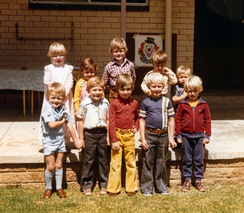 Group of young children standing on patio steps at a birthday party, Pooraka, Adelaide, November 1977. Digitally restored version.