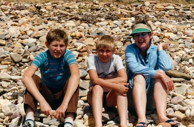 Paul, Mark and Desrae Hamon on a pebble beach, southern Adelaide, c. 1984